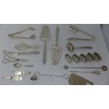 A collection of South American silver to include cake slices, napkin rings, asparagus tongs,