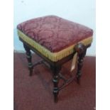 A Victorian rosewood adjustable piano stool, with damask velour upholstery, raised on turned legs