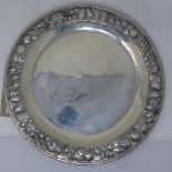 A Mexican silver charger, with embossed fruit border, stamped 900, 30oz