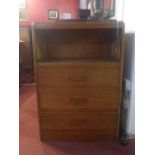 An Art Deco oak side cabinet, with recess above three drawers with Bakelite handles, H.89 W.62 D.