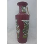 A Chinese red ground porcelain vase, decorated with various vases, bearing character marks to