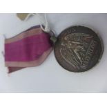 An 1815 Waterloo medal, awarded to John Curtis, 11th Regiment Light Dragoons
