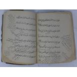 An 18th Century Persian leather bound book, handwritten in Farsi, with several Russian