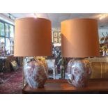 A pair of red marble style glass table lamps, with teracotta shades, H.36cm (2)