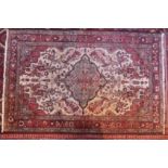 A north west Persian Borchalue rug, with a central floral medallion with repeating floral