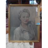 A 20th Century oil on board portrait of a lady with blonde hair, signed lower right, framed and