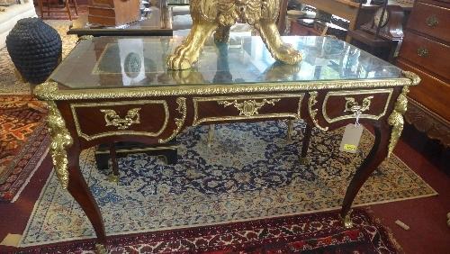 A Louis XV style king wood plat du jour desk, with single drawer, leather top, ormolu mounts, raised