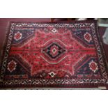 A fine South West Persian Qashgai rug, 182cm X 134cm. Central diamond medallion with repeating petal