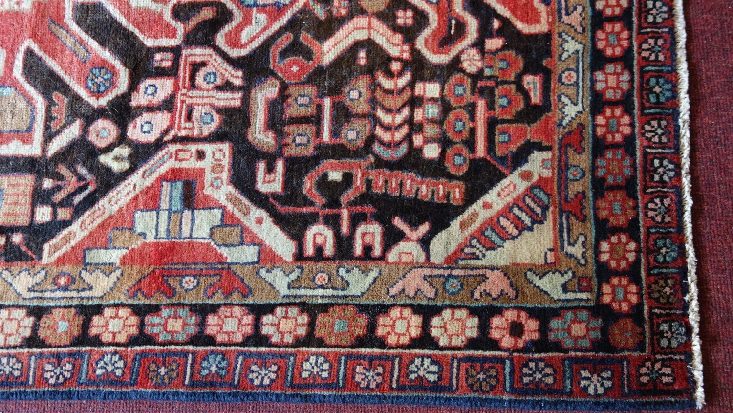 A fine North West Persian Hamadan rug, 201cm X 130cm. Repeating eagle motifs on a midnight field - Image 3 of 3