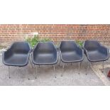 A set of four black Robin Day plastic chairs, (4)