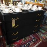 A pair of mid 20th Century American Military chests of four long drawers in an ebonised finish