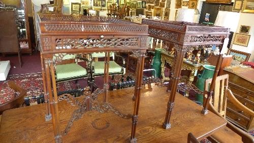 A pair of Chippendale style mahogany side tables, with carved and pierced gallery top, candle slide,