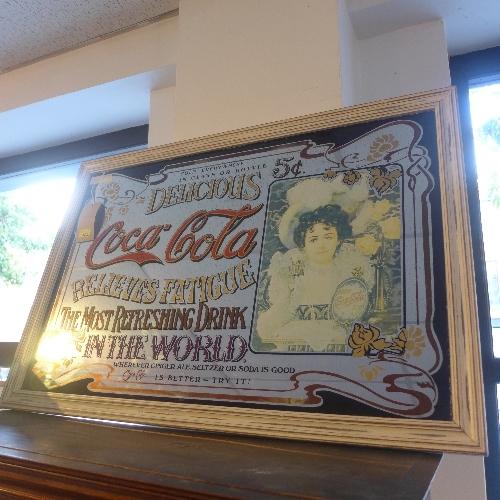 An early to mid 20th century advertising mirror for 'Coca Cola', 100x67cm