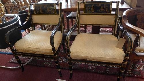 A pair of Drexel Heritage black lacquered armchairs, in the Chinoserie taste, with cream silk