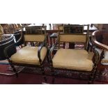 A pair of Drexel Heritage black lacquered armchairs, in the Chinoserie taste, with cream silk