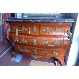 A French Louis XV style kingwood commode, the marble top over two short and two long drawers with