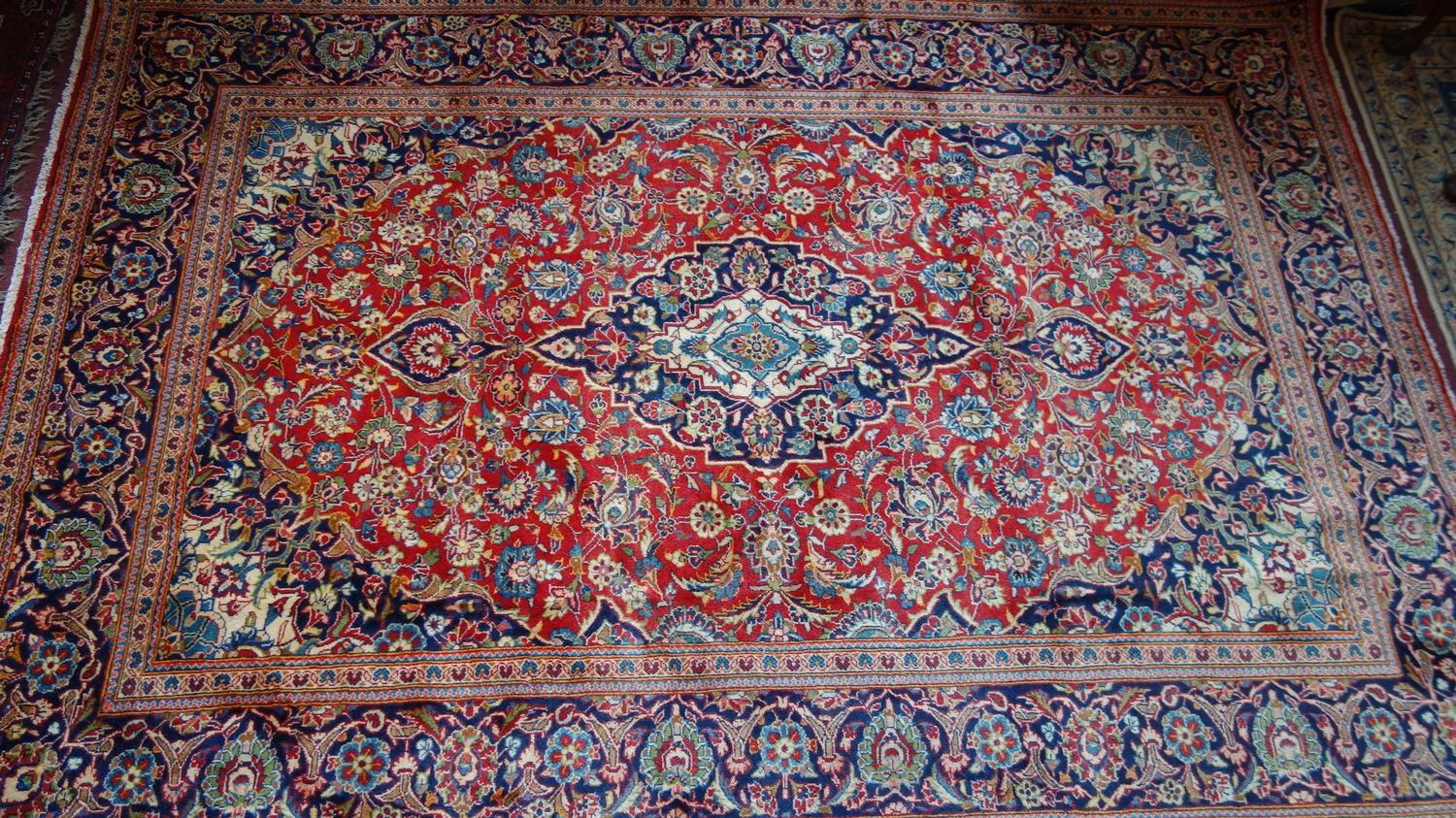 A fine Central Persian Kashan carpet, 290cm X 200cm. Central double pendent medallion with repeating