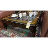 A large Drexel Heritage burr walnut and black lacquered square coffee table, with gilt floral