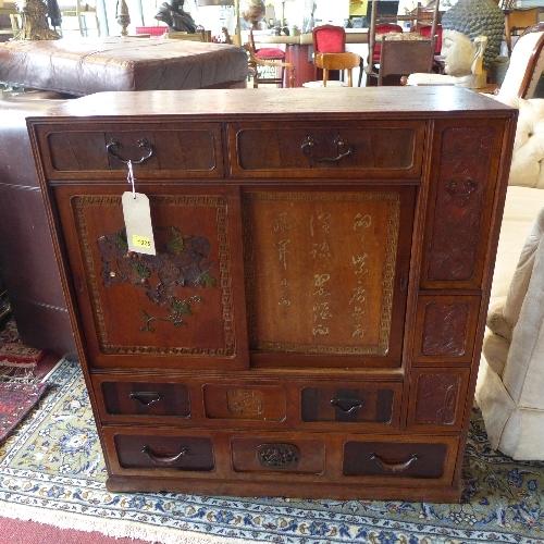 A late 19th century Chinese hardwood cabinet, with two sliding doors with carved hard stone inlay,