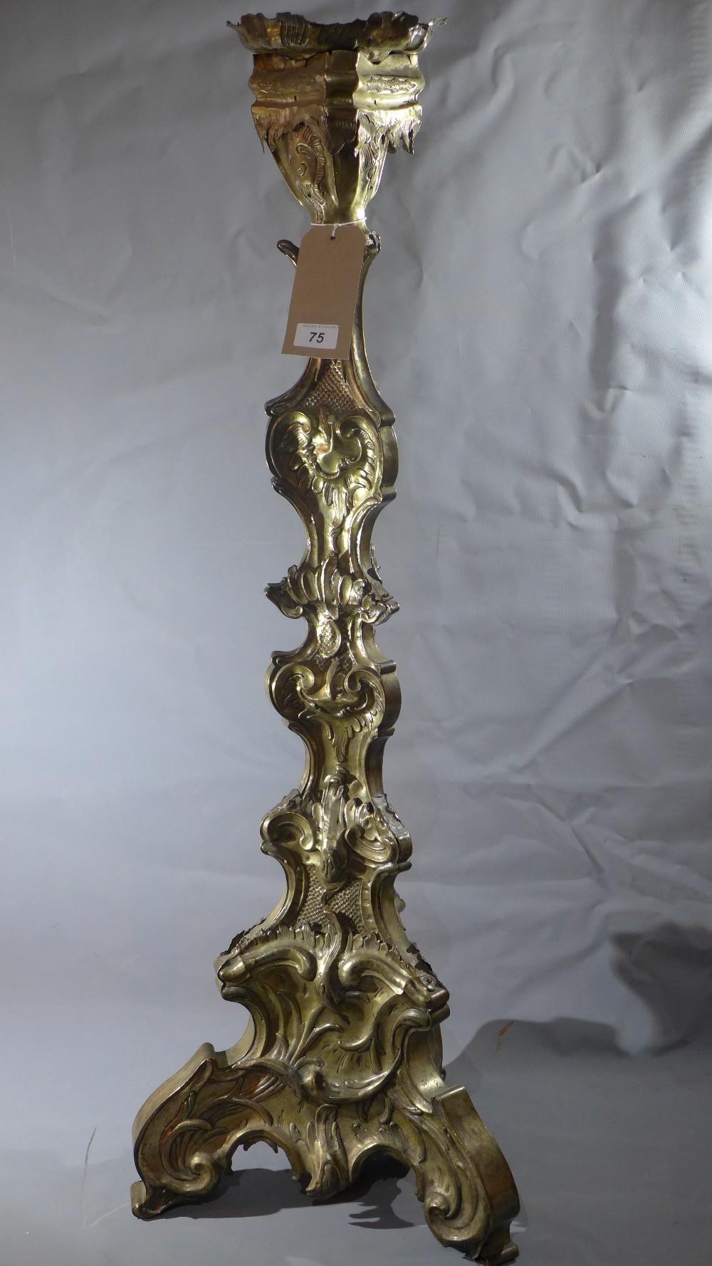 A large 19th century Rococo style silver plated altar pricket stick, embossed decoration, raised