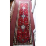 A fine North West Persian Hamadan runner, 298cm X 80cm. Repeating stylised pendent medallion with