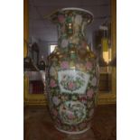 A mid 20th century Chinese famille rose vase, decorated with figures in courtyard scenes, having