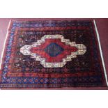 A fine North West Persian Senneh rug, 175cm X 130cm. Double diamond motifs central medallion with