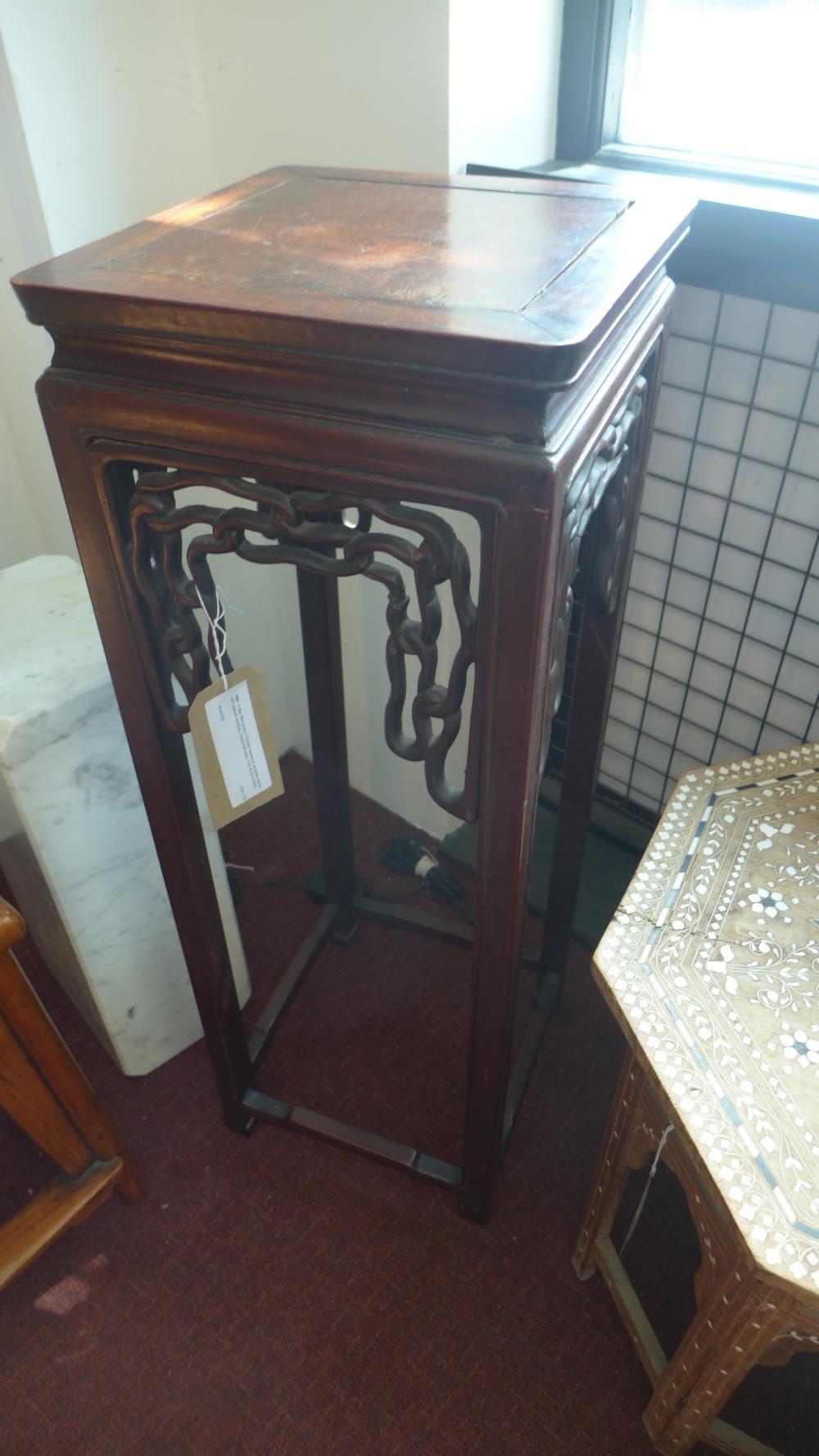 A late 19th century Chinese hardwood jardiniere stand, with padouk wood top, carved fret work, H.