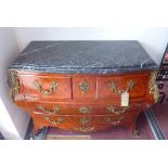 A French Louis XV style commode, the shaped black marble top over two short and two long drawers