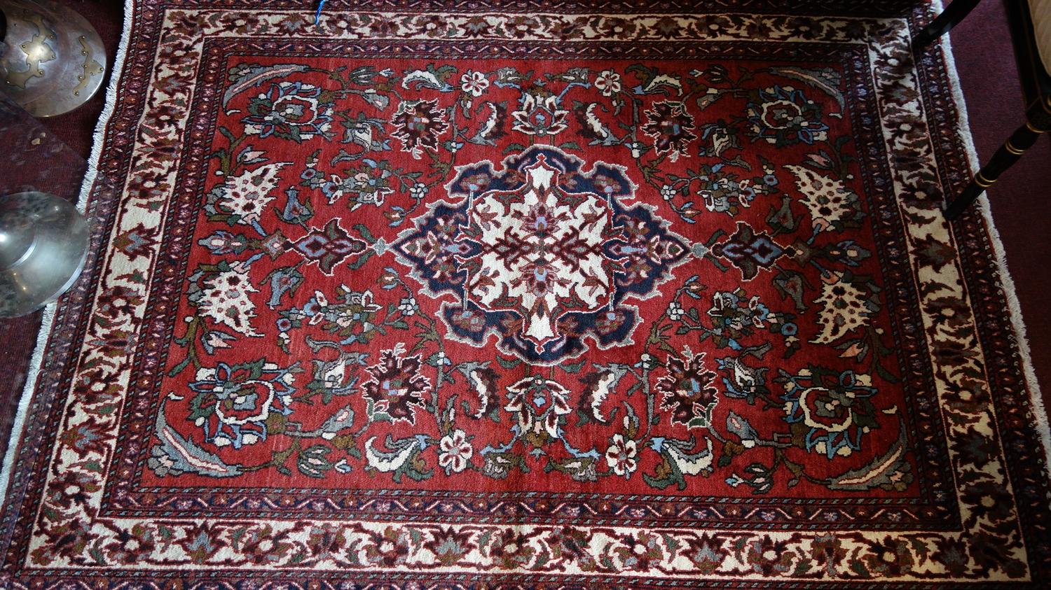 A fine Central Persian Isfahan rug, 210cm X 155cm. Central double pendent medallion with repeating