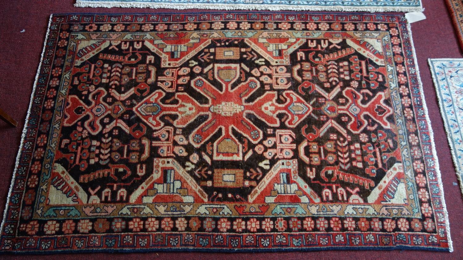 A fine North West Persian Hamadan rug, 201cm X 130cm. Repeating eagle motifs on a midnight field