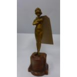 A small Art Deco bronze nude figure with crossed arms on a plinth base, H.24cm