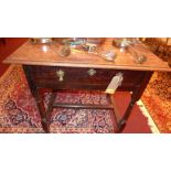 A 19th Century oak side table, having single frieze drawer raised on turned stretchered supports