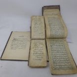 A set of three Persian leather bound books, two handwritten, one part print (3)