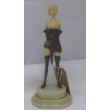 An Art Deco semi nude figure with spelter clothing on an onyx stepped base, H.35cm