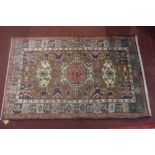 A North West Persian Tafresh rug, 192cm x 123cm, triple pole medallion with repeating petal motifs o