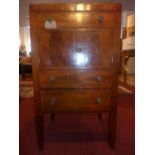 An early 19th Century George III mahogany and inlaid nightstand, with opening top compartment over