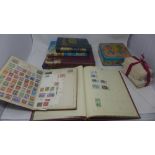 A large collection of vintage stamps, some in albums, together with a stamp book (qty)