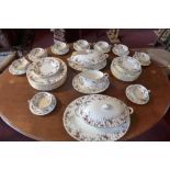 A large 'Ancestral' Minton dinner service with pink and blue floral design (qty)