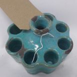 A Persian turquoise glazed brush holder vase, H.10cm