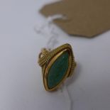 A ladies jade ring, having rope design to sides, marked 750