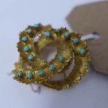 An 18ct yellow gold Italian brooch of spiral form, inset with turquoise, marked 750