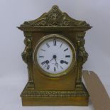 A 19th century polished brass mantel clock, architectural case with figural columns flanking Roman