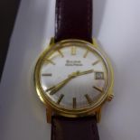 A Bulova Accutron gold plated gentleman's wristwatch, silvered dial with gilt baton markers, date