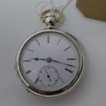 A late 19th century silver coin pocket watch, white enamel dial with Roman numerals, subsidiary