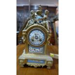 A 19th century French gilded bronze eight day mantel clock, drum movement, ceramic dial painted with