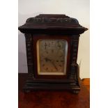 A 19th century oak mantel clock, the silvered dial with Roman numerals, two sub dials, the oak