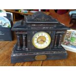 A late 19th century slate and marble mantle clock