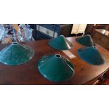 A set of five green glass snooker light shades