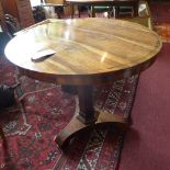 A William IV rosewood tilt top breakfast table, with brass inlay, raised on triform base